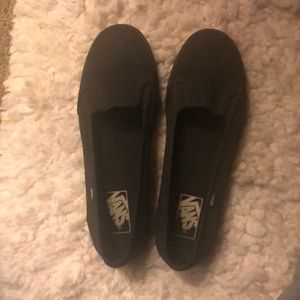 All black slip on vans.